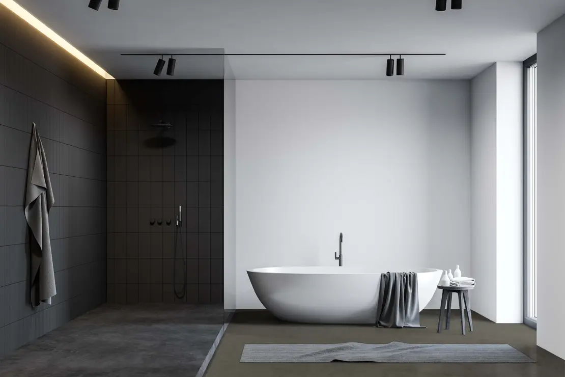 Ducha con piso de microcemento de tonalidad gris profundo. Ducha con piso de microcemento de tonalidad gris profundo.